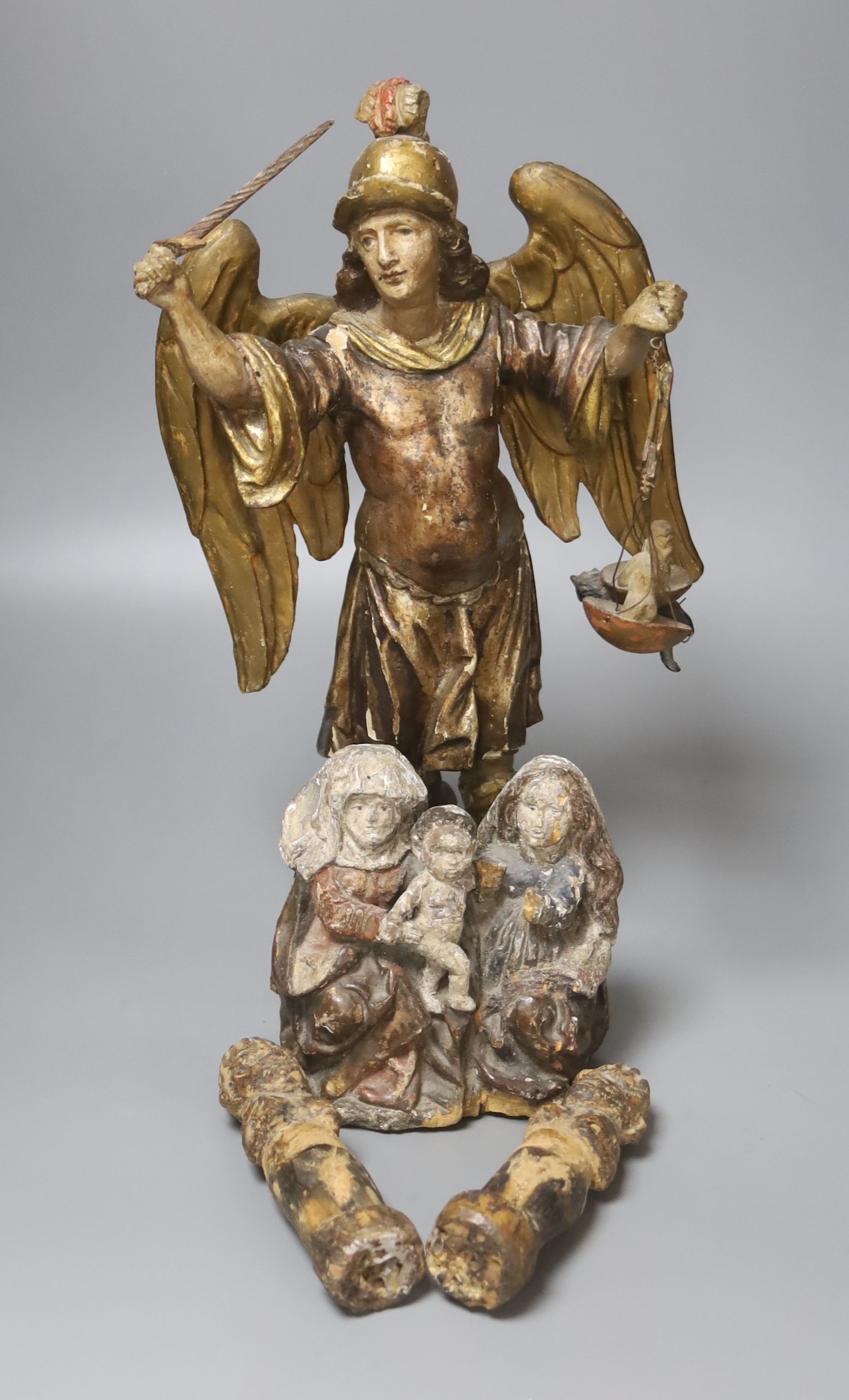 An 18th / 19th century Italian carved polychrome wood figure of Gabriel, height 37cm, and three other carvings